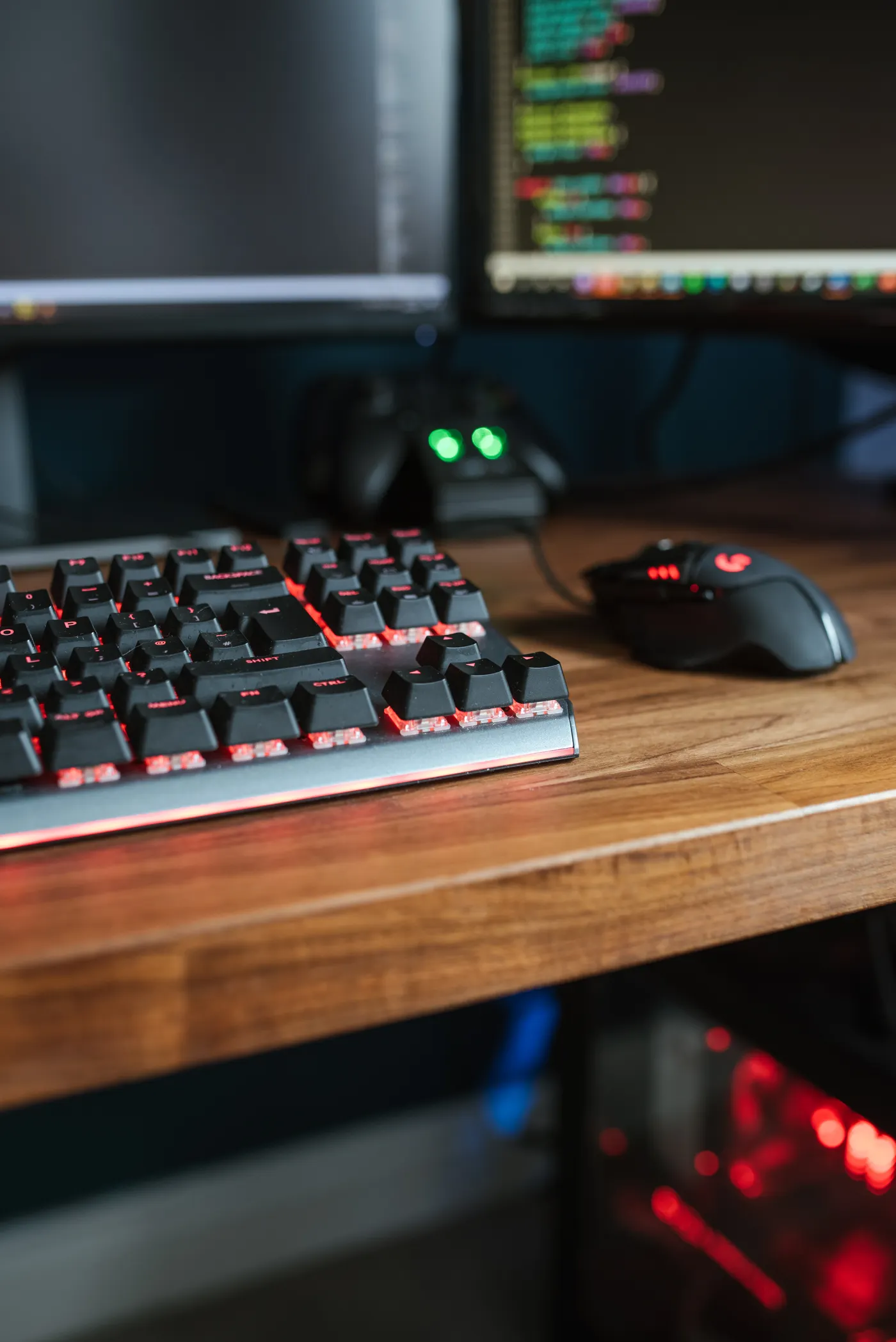 A development workstation with monitors, a keyboard and a computer.